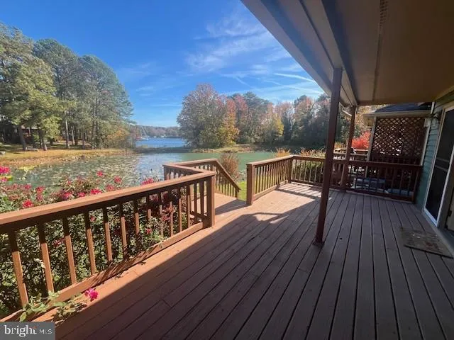a view of balcony with wooden floor