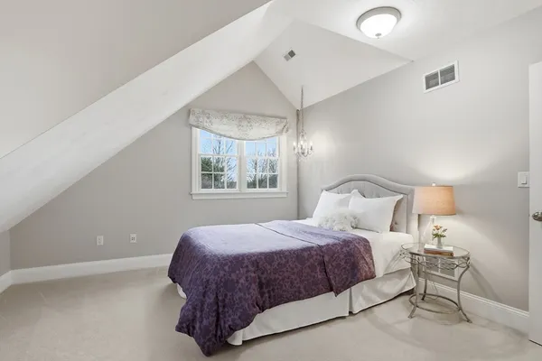 a bed room with a bed and a table
