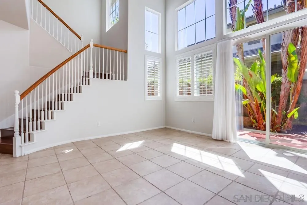5423 Foxtail Loop Carlsbad, CA 92010 - Photo 17 of 53 a view of an entryway with wooden floor