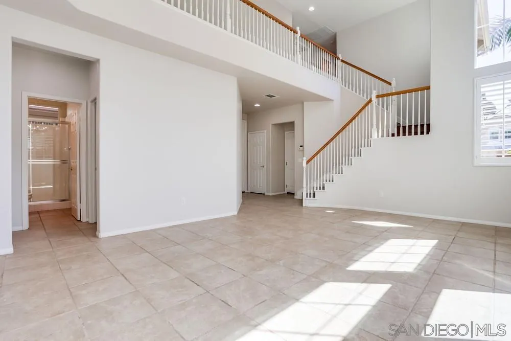 5423 Foxtail Loop Carlsbad, CA 92010 - Photo 18 of 53 a view of an entryway with staircase
