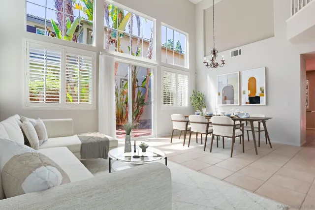 a living room with furniture fireplace and a window