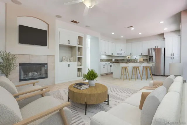 a living room with furniture a fireplace and a flat screen tv