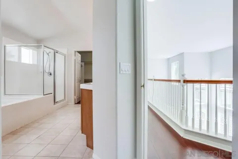 a spacious bathroom with a double vanity sink and a mirror