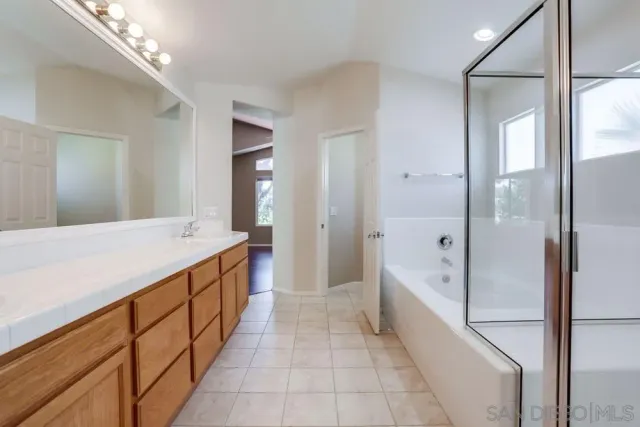 a spacious bathroom with a bathtub and a toilet
