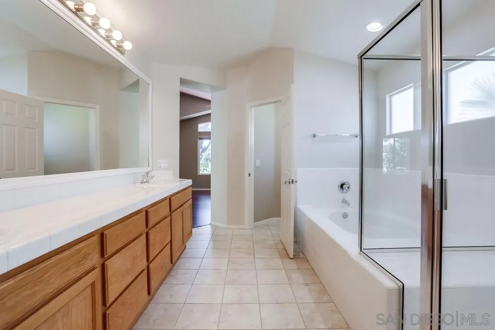 5423 Foxtail Loop Carlsbad, CA 92010 - Photo 35 of 53 a large bathroom with a tub and shower
