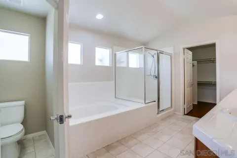 a white bath tub sitting next to a window