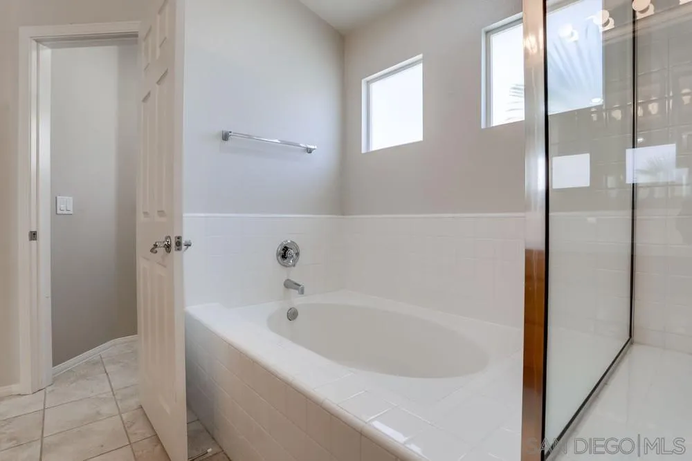 5423 Foxtail Loop Carlsbad, CA 92010 - Photo 37 of 53 a white bath tub sitting next to a window