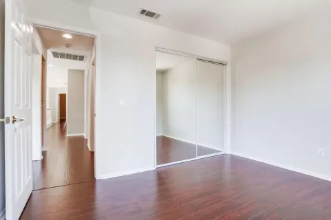 a bathroom with a sink toilet a mirror and shower