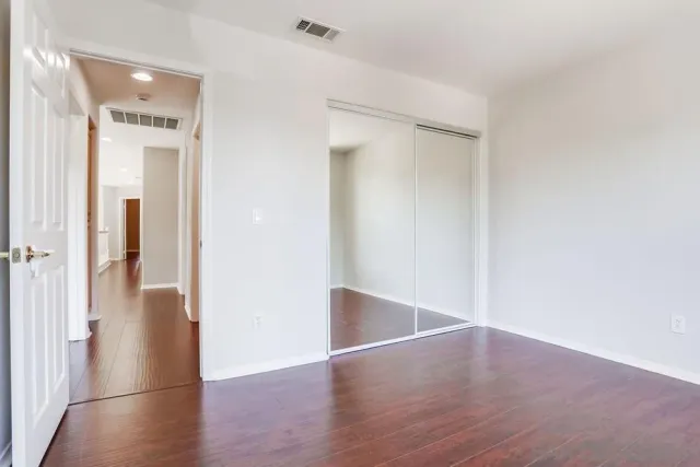 a bathroom with a sink toilet a mirror and shower