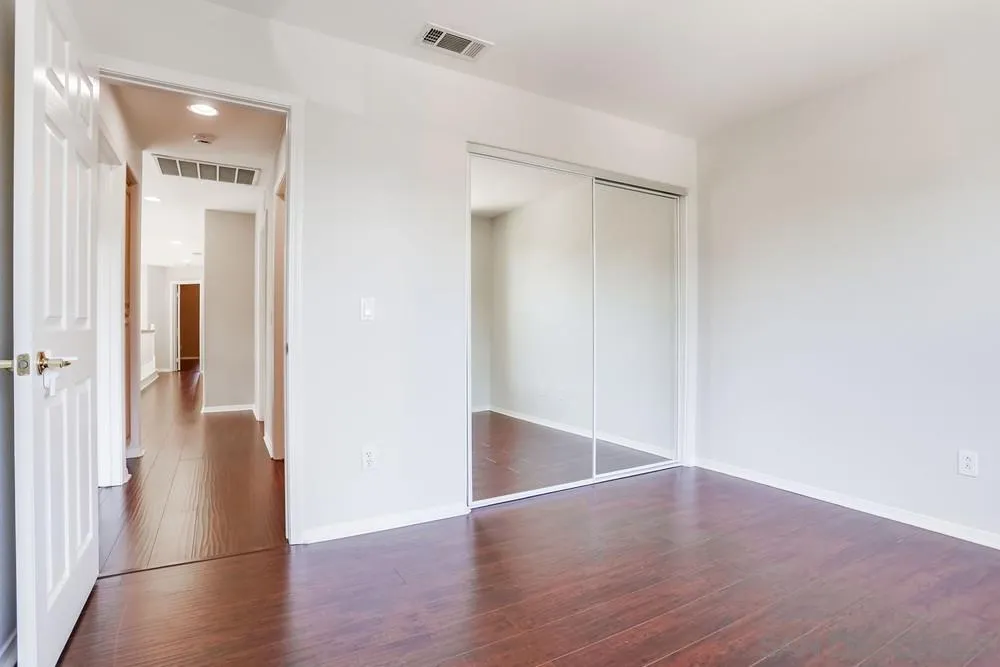 5423 Foxtail Loop Carlsbad, CA 92010 - Photo 41 of 53 a view of a hallway with wooden floor