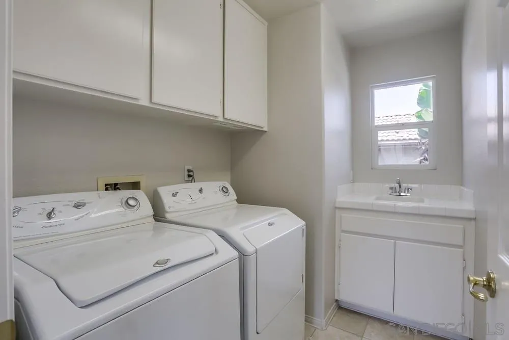 5423 Foxtail Loop Carlsbad, CA 92010 - Photo 43 of 53 a utility room with dryer and washer