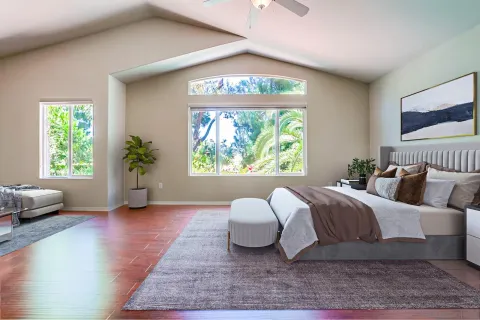 a spacious bedroom with a large bed and a large window