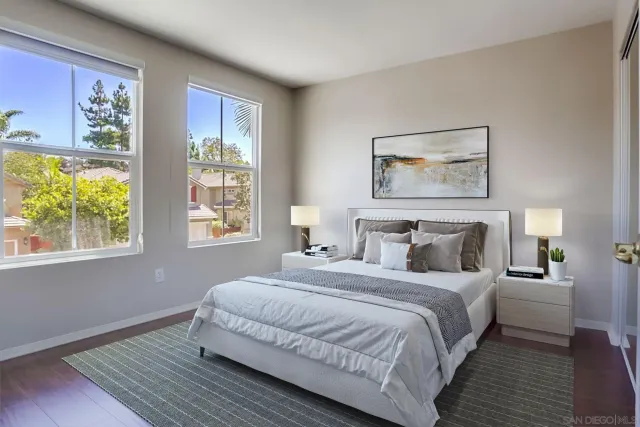 a bedroom with double bed and a window