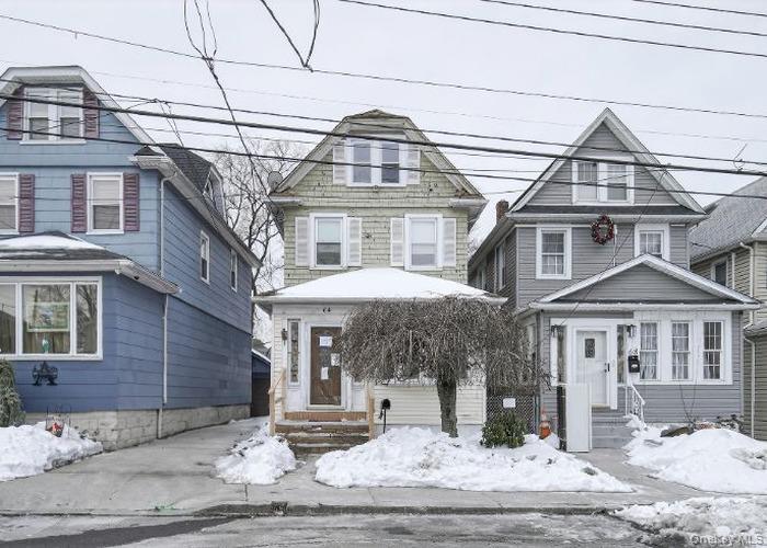 64 Watchogue Road Staten Island, NY 10314 - Photo 1 of 23 a front view of a house with a yard