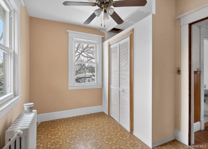 64 Watchogue Road Staten Island, NY 10314 - Photo 17 of 23 a view of empty room with window and ceiling fan