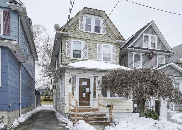 64 Watchogue Road Staten Island, NY 10314 - Photo 2 of 23 a front view of a house with a tree