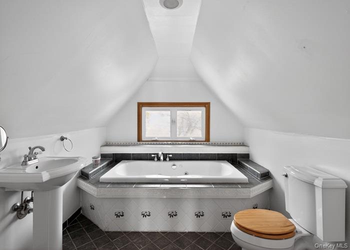 64 Watchogue Road Staten Island, NY 10314 - Photo 22 of 23 a bathroom with a sink and a toilet