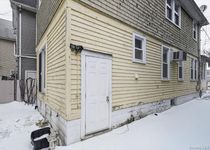 64 Watchogue Road Staten Island, NY 10314 - Photo 4 of 23 a view of a house with a yard and garage