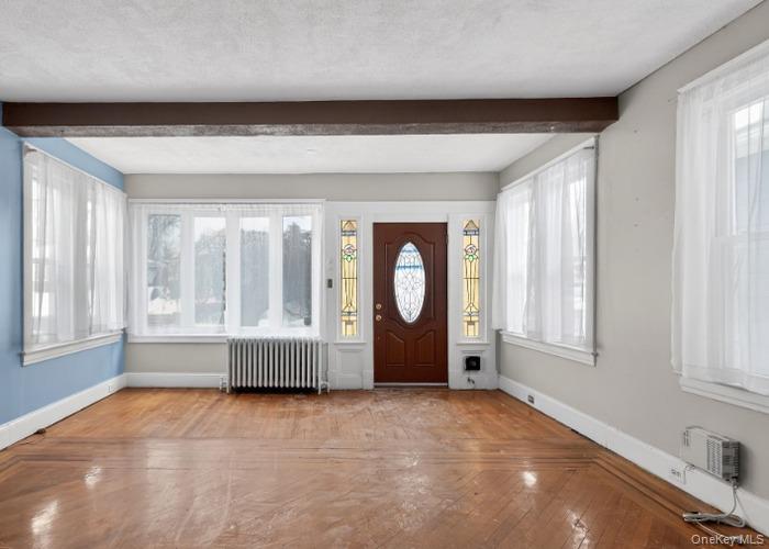 64 Watchogue Road Staten Island, NY 10314 - Photo 6 of 23 a view of an empty room with a window