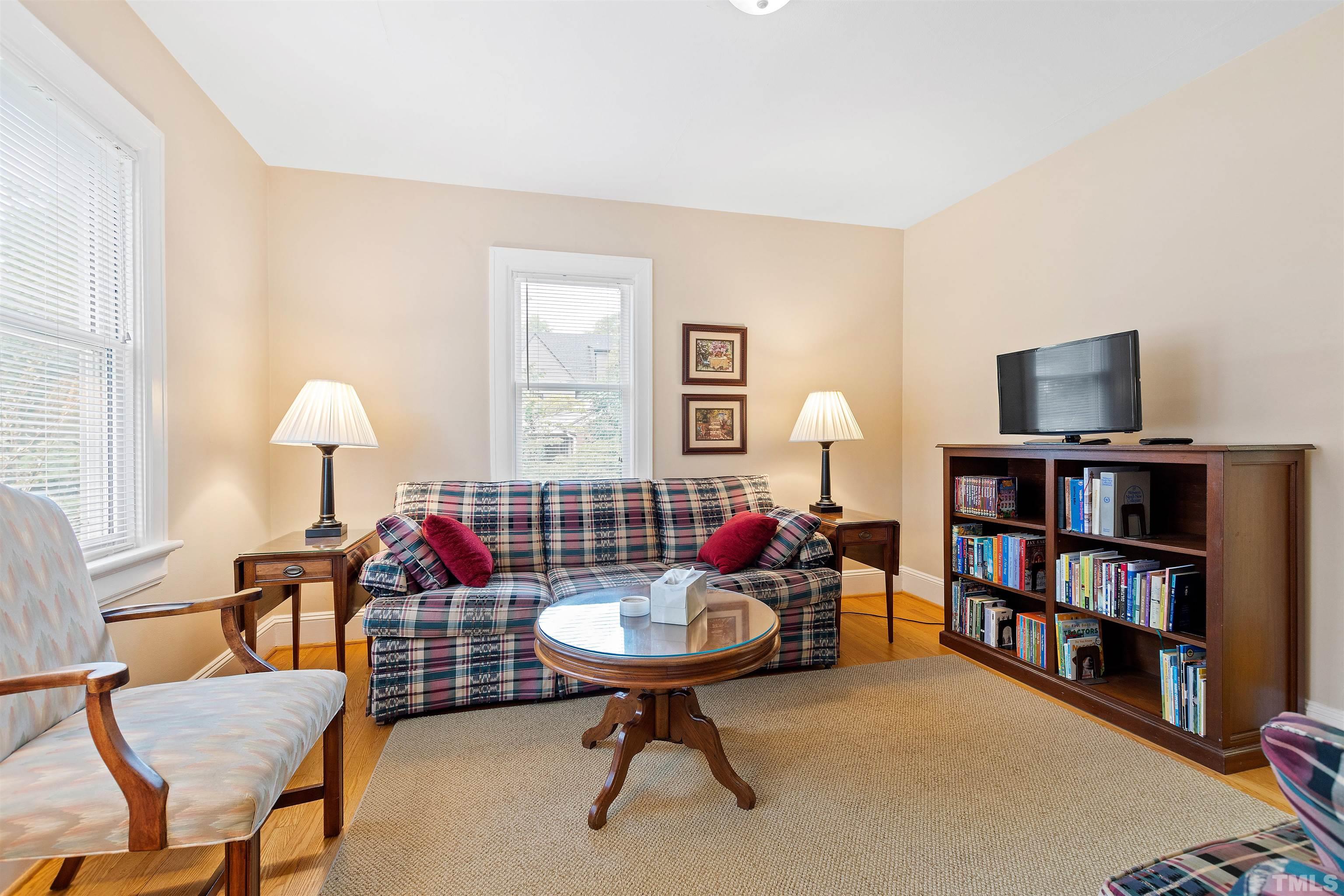 110 Shepherd Street Raleigh, NC 27607 - Photo 14 of 41 a living room with furniture and a book shelf