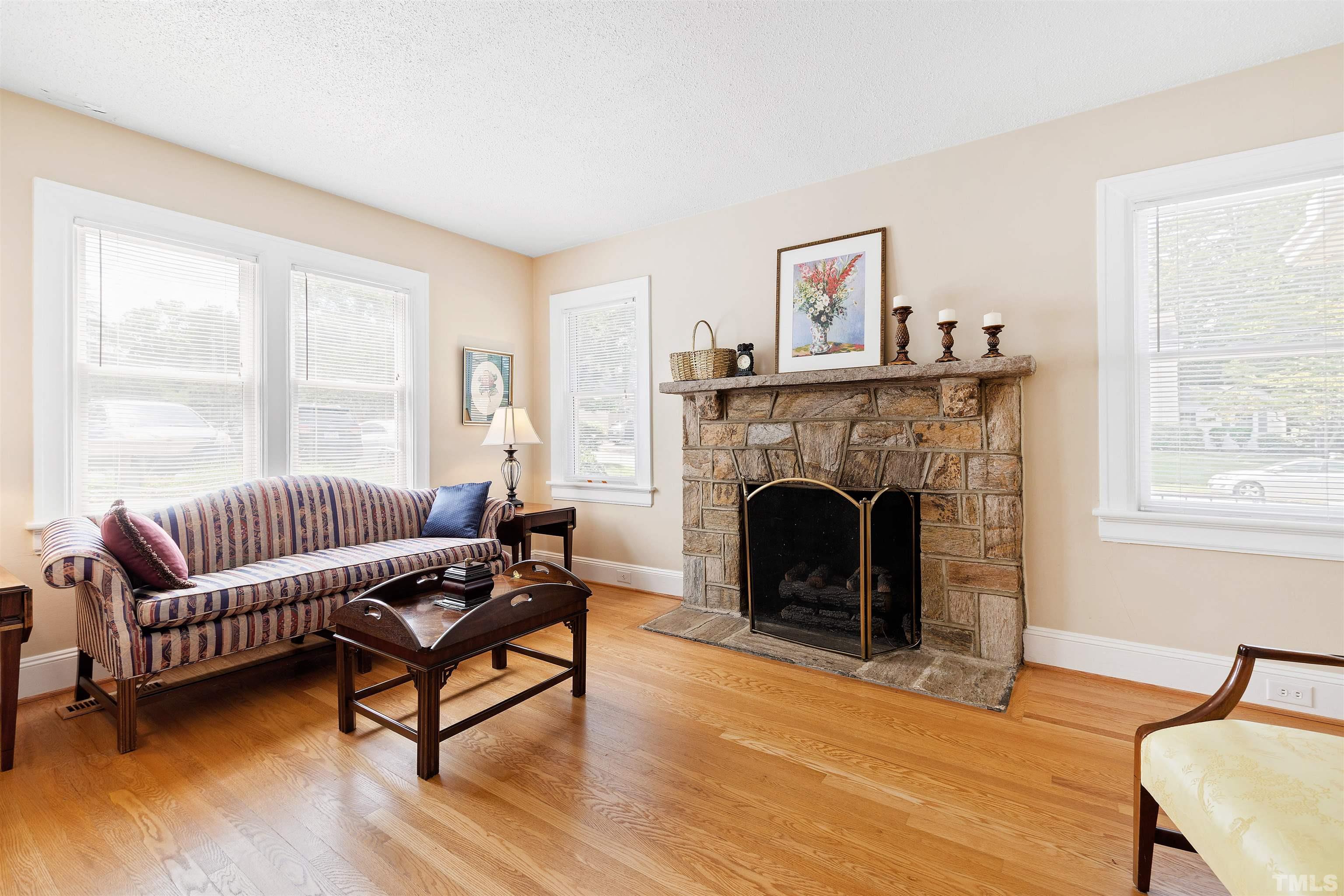 110 Shepherd Street Raleigh, NC 27607 - Photo 17 of 41 a living room with furniture and a fireplace
