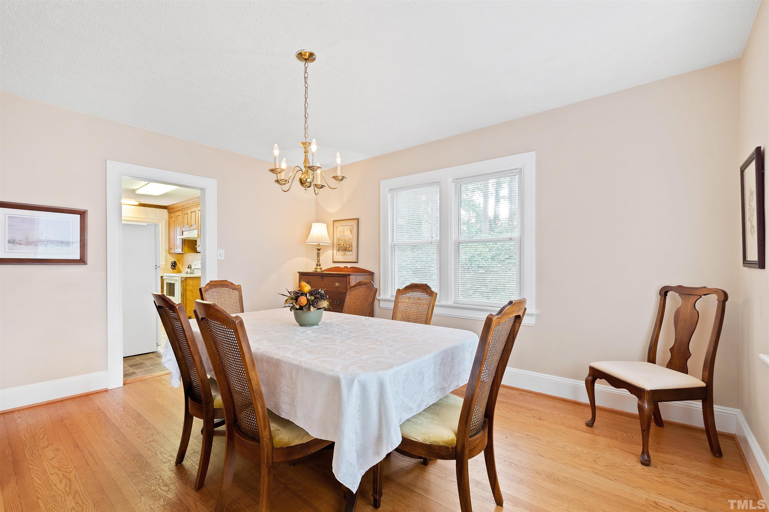 110 Shepherd Street Raleigh, NC 27607 - Photo 19 of 41 a view of a dining room with furniture window and wooden floor