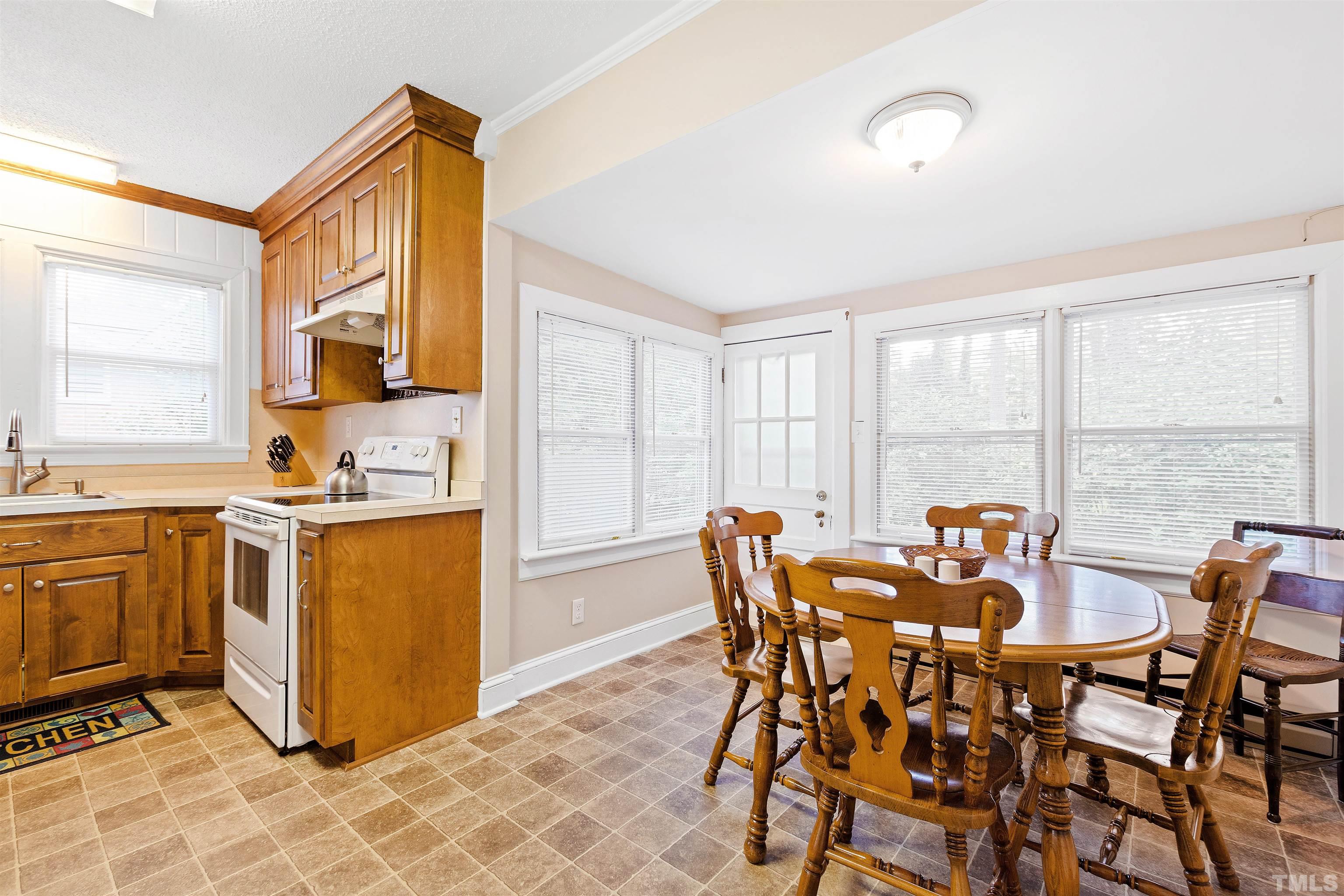 110 Shepherd Street Raleigh, NC 27607 - Photo 21 of 41 a view of a dining room with furniture and a window