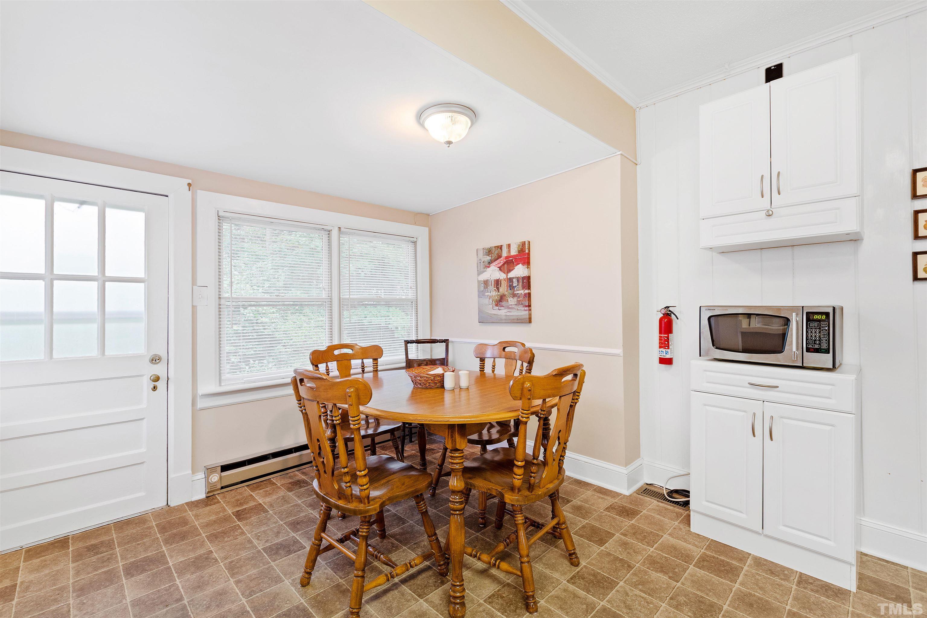 110 Shepherd Street Raleigh, NC 27607 - Photo 25 of 41 a view of a dining room with furniture and a window