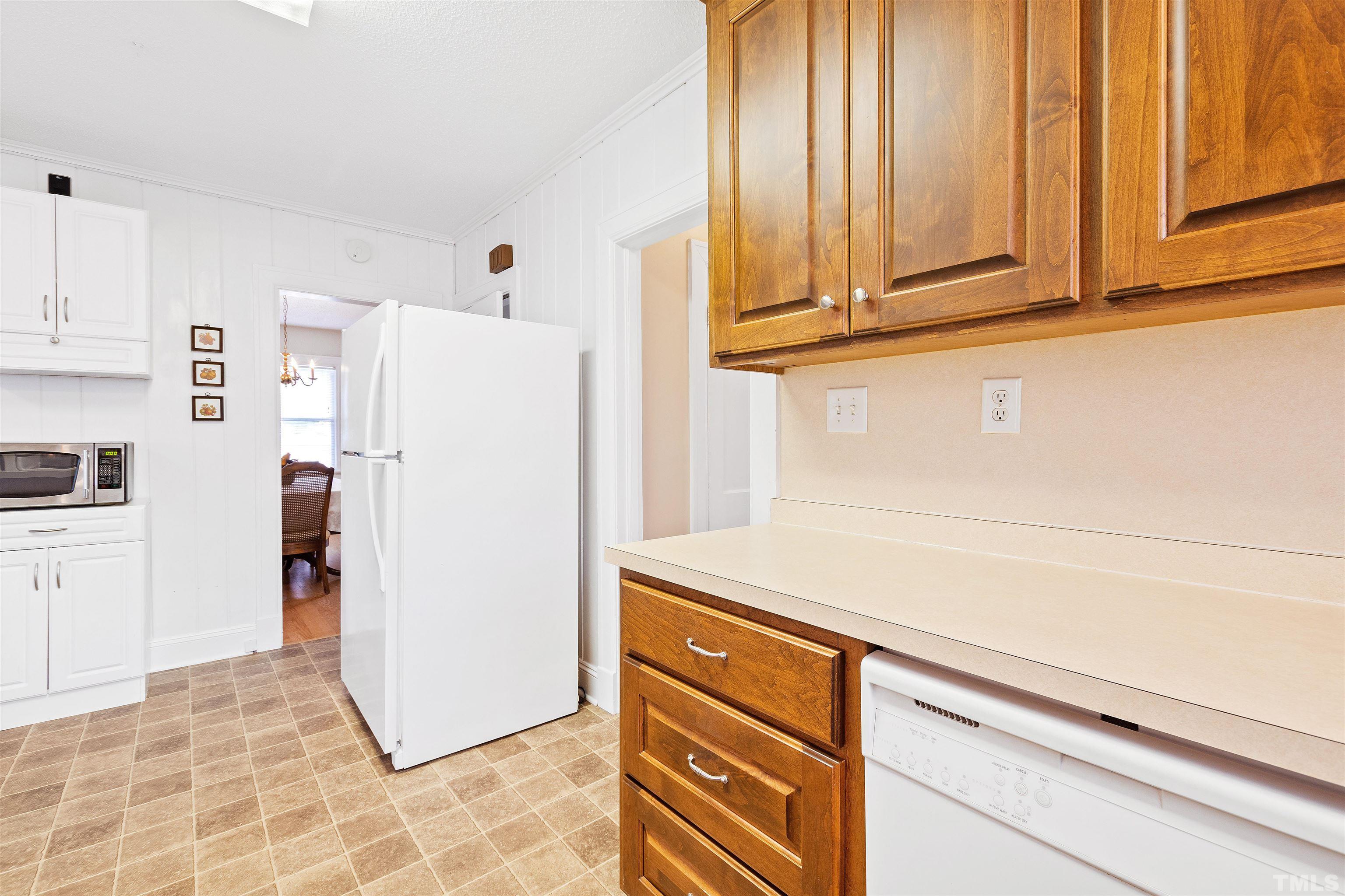 110 Shepherd Street Raleigh, NC 27607 - Photo 26 of 41 a view of a kitchen with refrigerator and cabinet