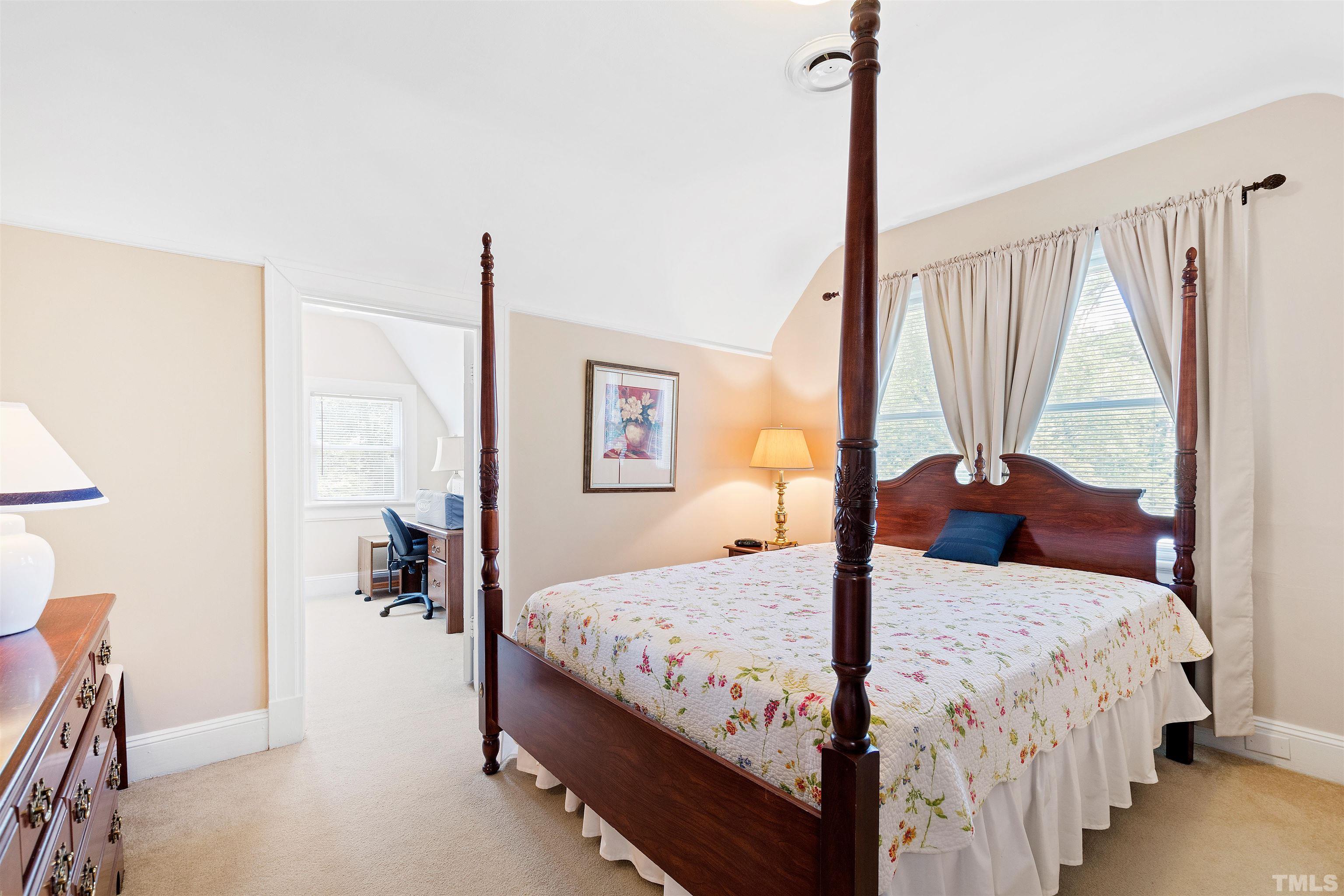 110 Shepherd Street Raleigh, NC 27607 - Photo 28 of 41 a bedroom with a bed and large window