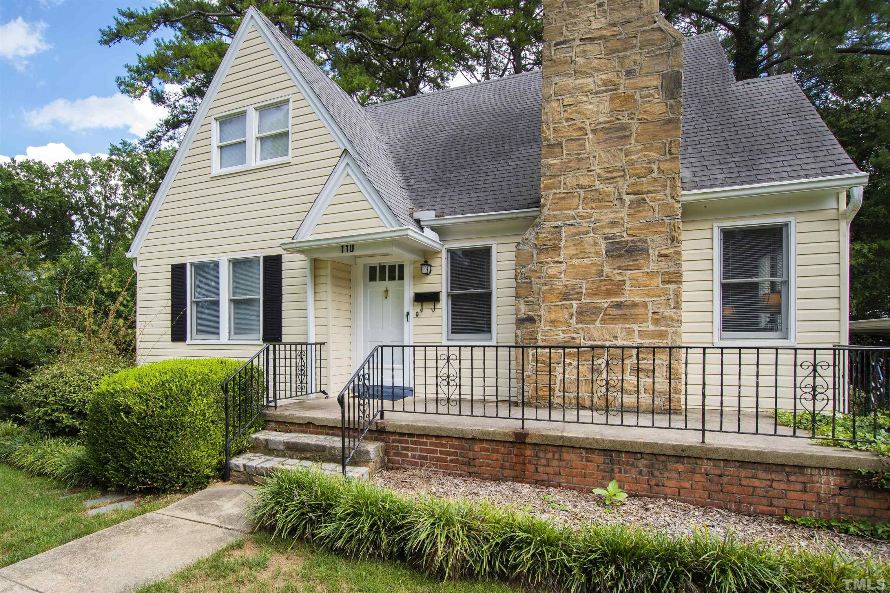 110 Shepherd Street Raleigh, NC 27607 - Photo 3 of 41 a front view of a house with a garden