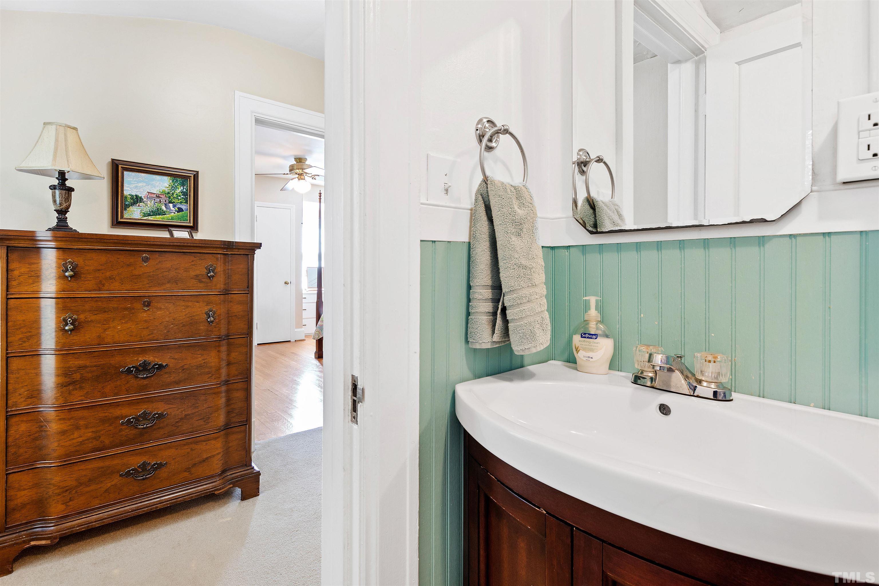 110 Shepherd Street Raleigh, NC 27607 - Photo 31 of 41 a bathroom with a sink and a mirror