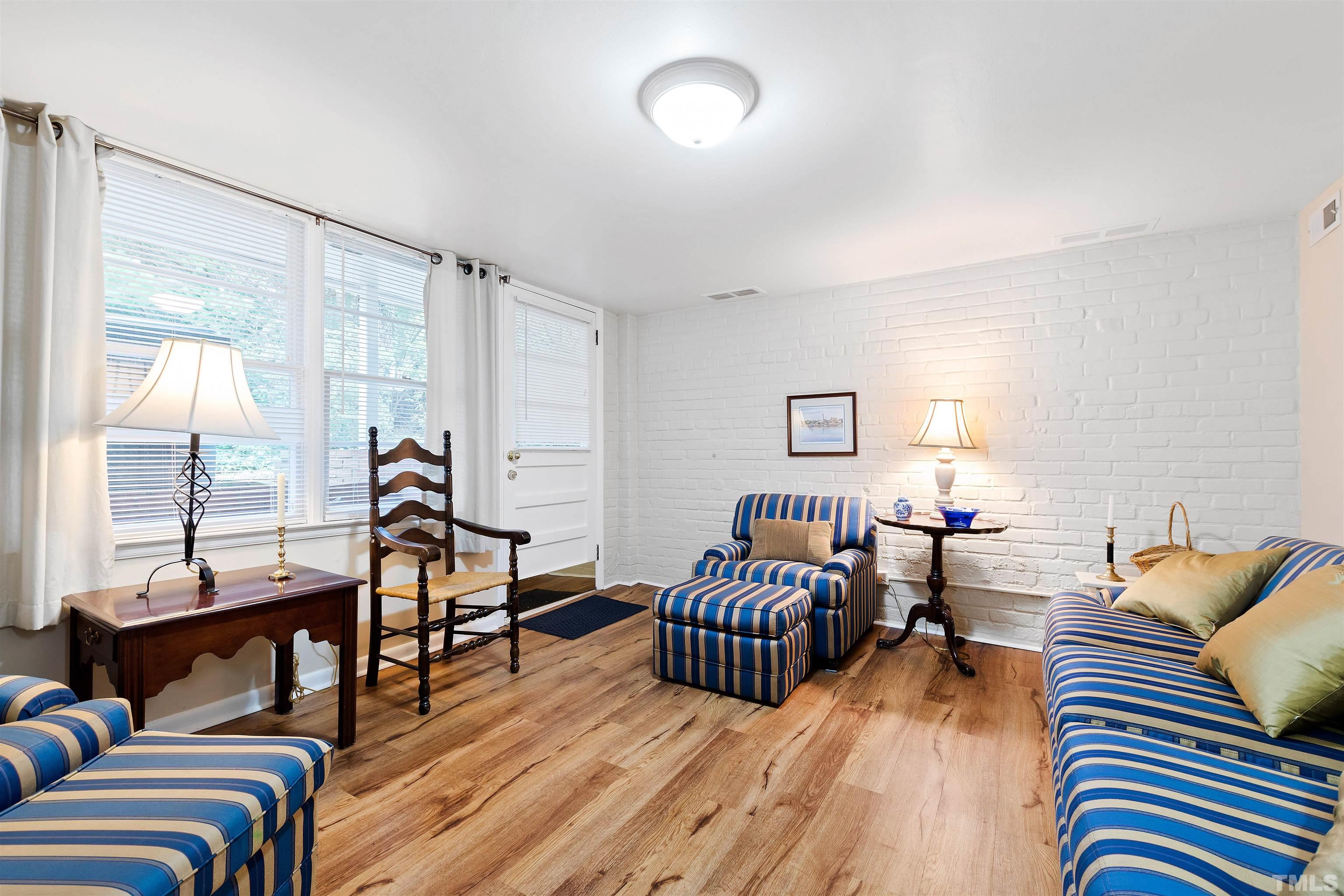 110 Shepherd Street Raleigh, NC 27607 - Photo 36 of 41 a living room with furniture and a wooden floor
