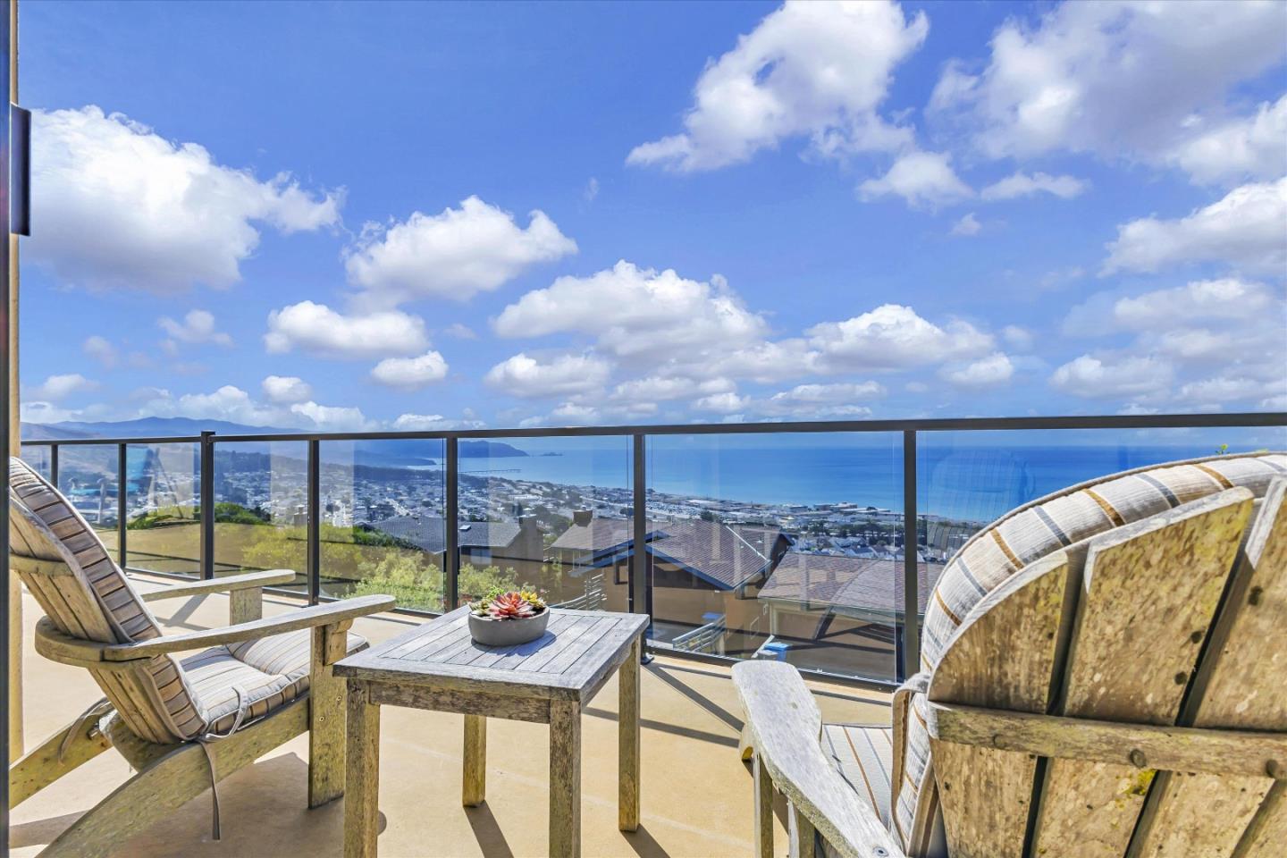 a view of a balcony with furniture