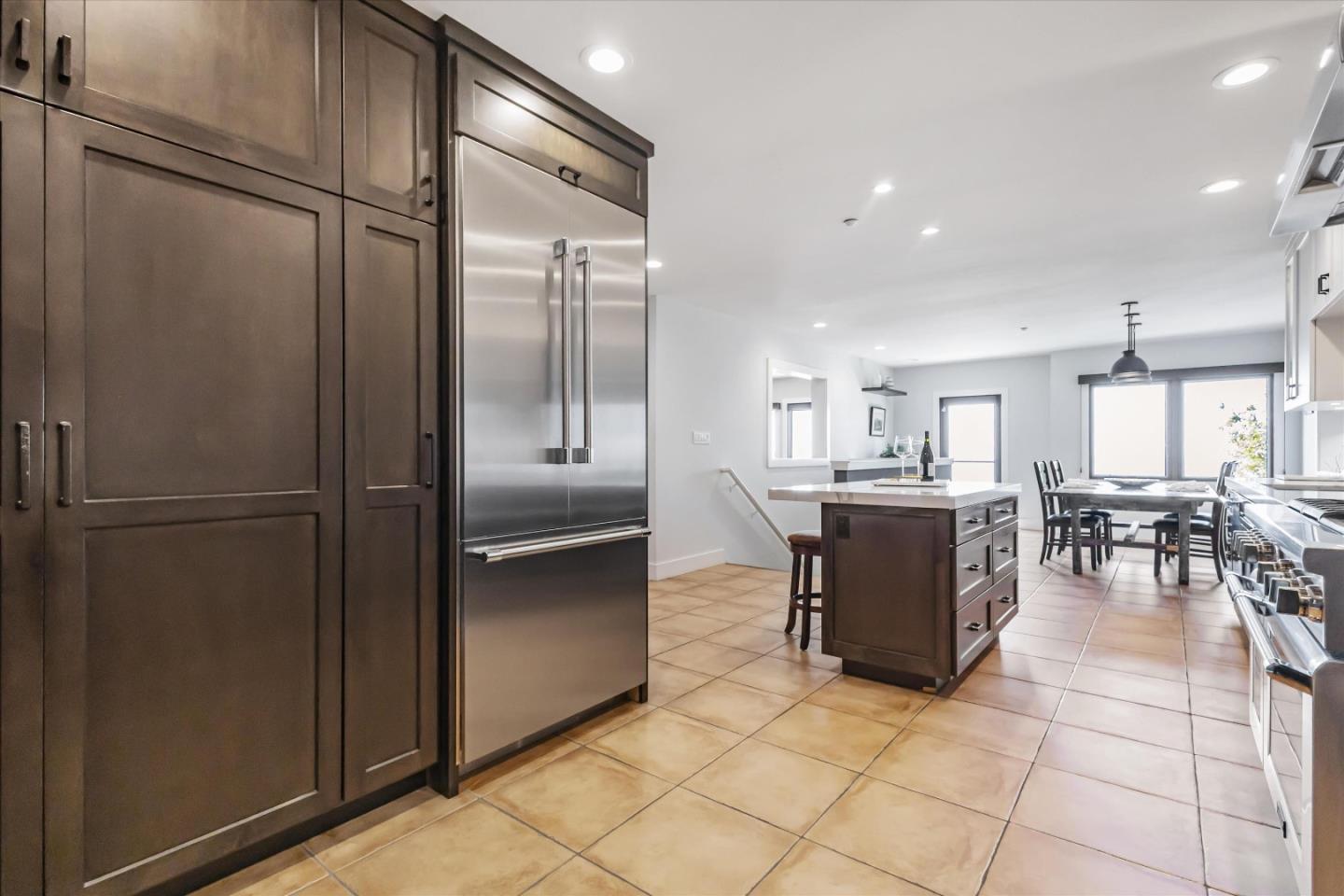 327 Farallon Avenue Pacifica, CA 94044 - Photo 17 of 74 a kitchen with a refrigerator and cabinets