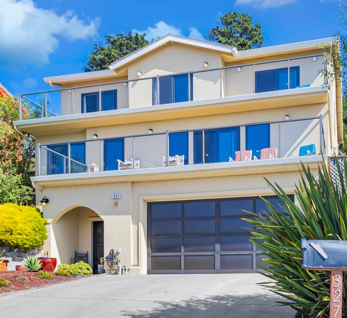 327 Farallon Avenue Pacifica, CA 94044 - Photo 2 of 74 a front view of a house with a yard and garage