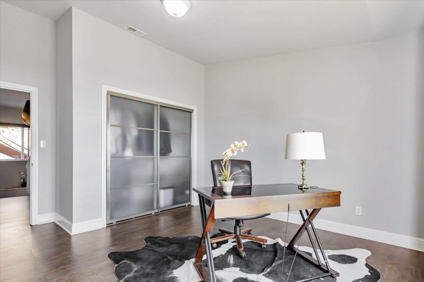 327 Farallon Avenue Pacifica, CA 94044 - Photo 42 of 74 a workspace with furniture and wooden floor