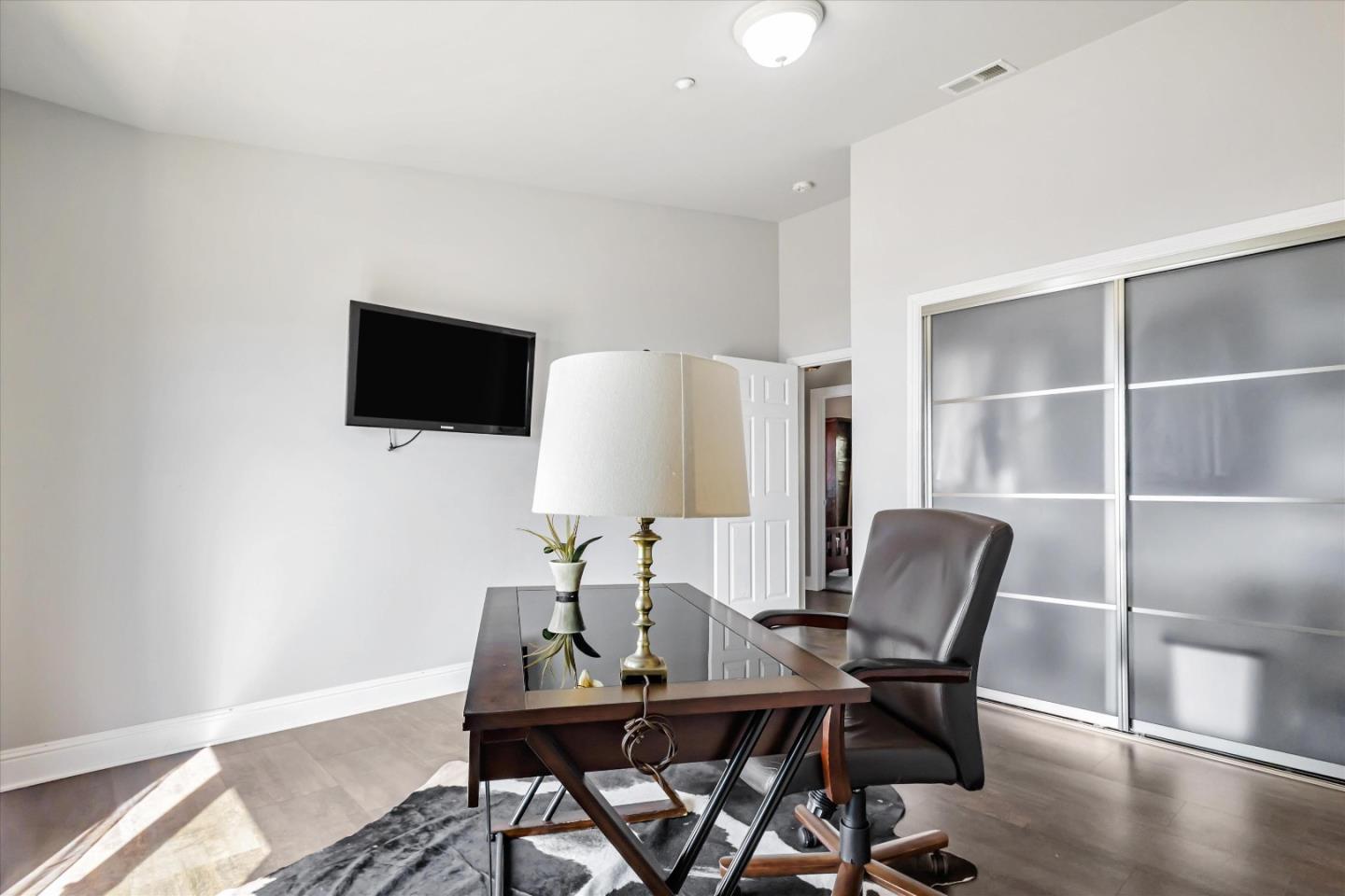 327 Farallon Avenue Pacifica, CA 94044 - Photo 43 of 74 a view of a workspace with furniture and a flat screen tv
