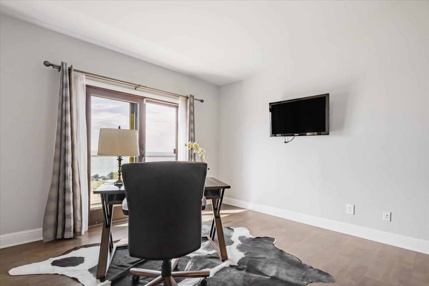 327 Farallon Avenue Pacifica, CA 94044 - Photo 44 of 74 a view of a livingroom with furniture and a flat screen tv