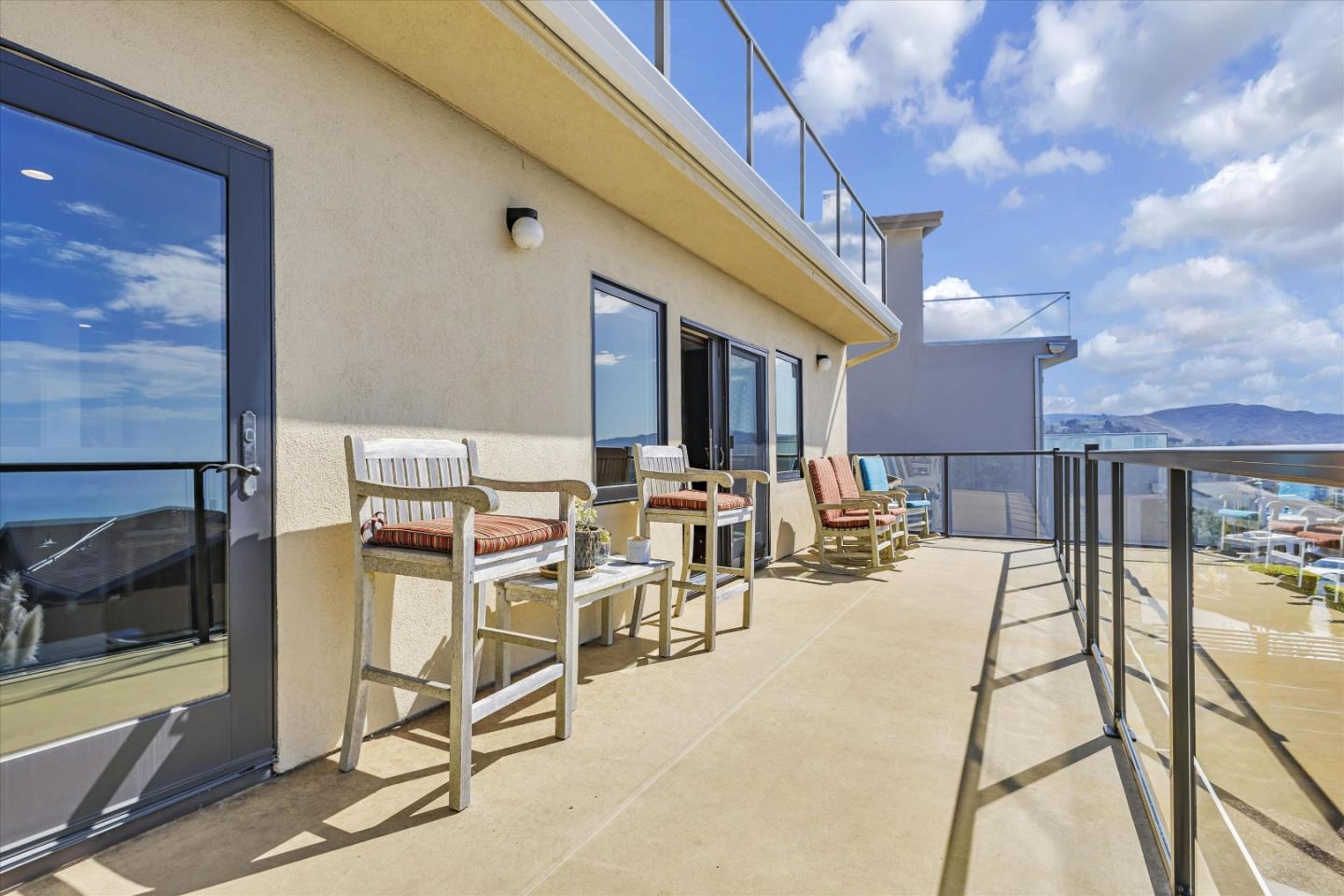 327 Farallon Avenue Pacifica, CA 94044 - Photo 5 of 74 a view of a patio with dining table and chairs with a view of the house