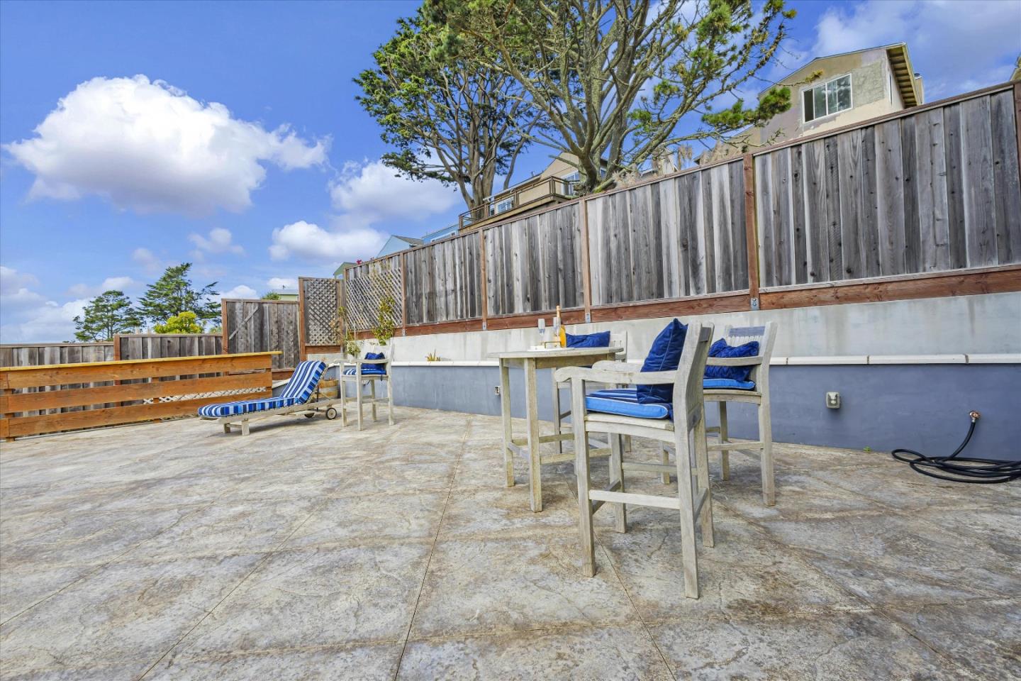 327 Farallon Avenue Pacifica, CA 94044 - Photo 62 of 74 a backyard of a house with table and chairs