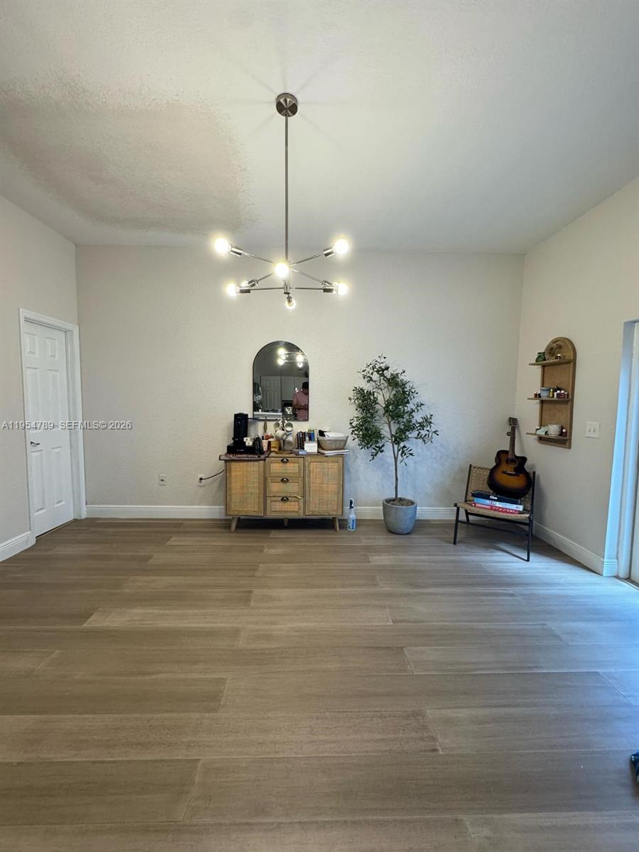 1948 Southeast 24th Avenue Homestead, FL 33035 - Photo 3 of 6 a view of a room with gym equipment