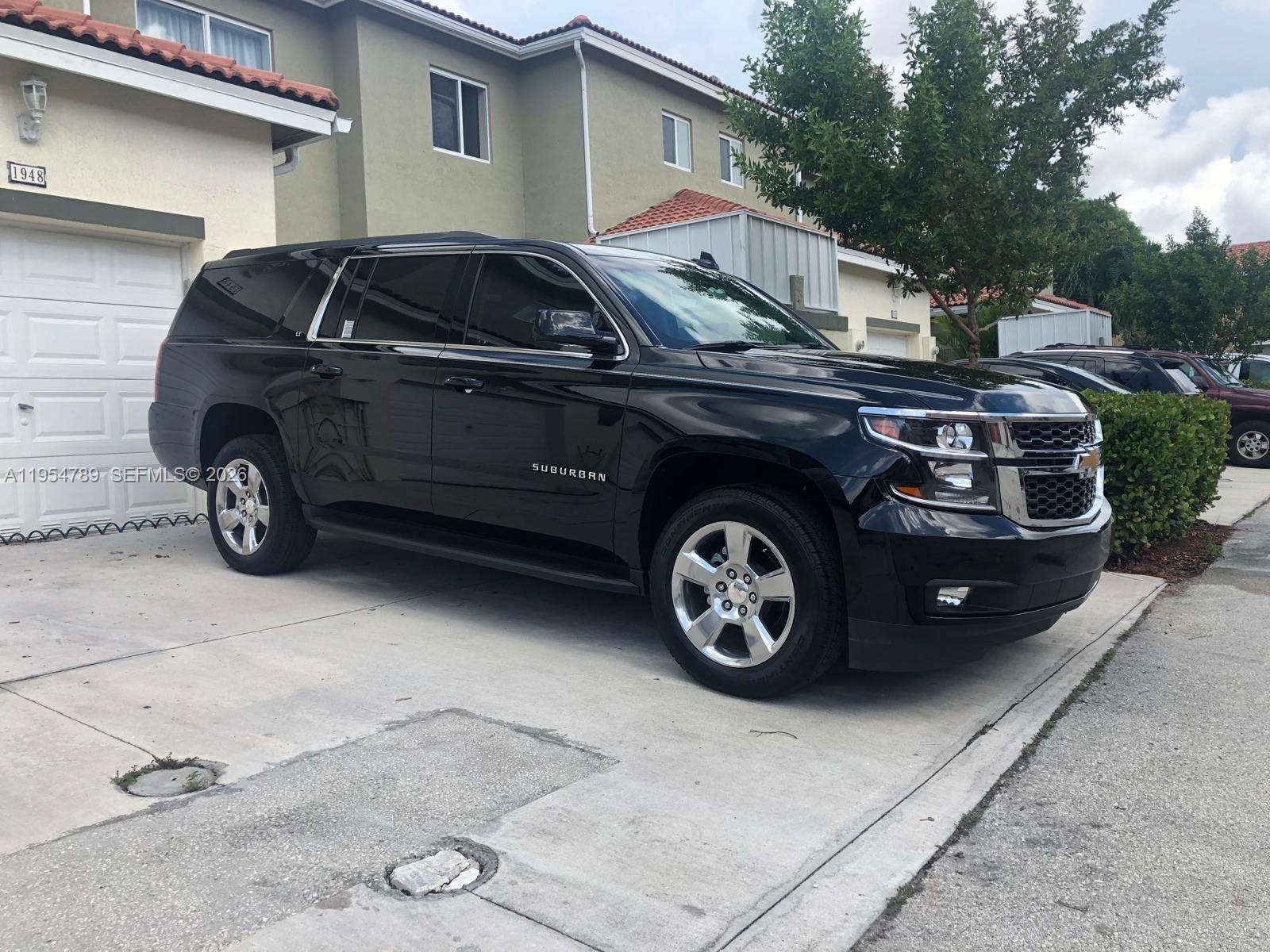 1948 Southeast 24th Avenue Homestead, FL 33035 - Photo 6 of 6 a car parked in a garage