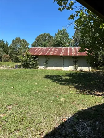 a view of a field with a tree