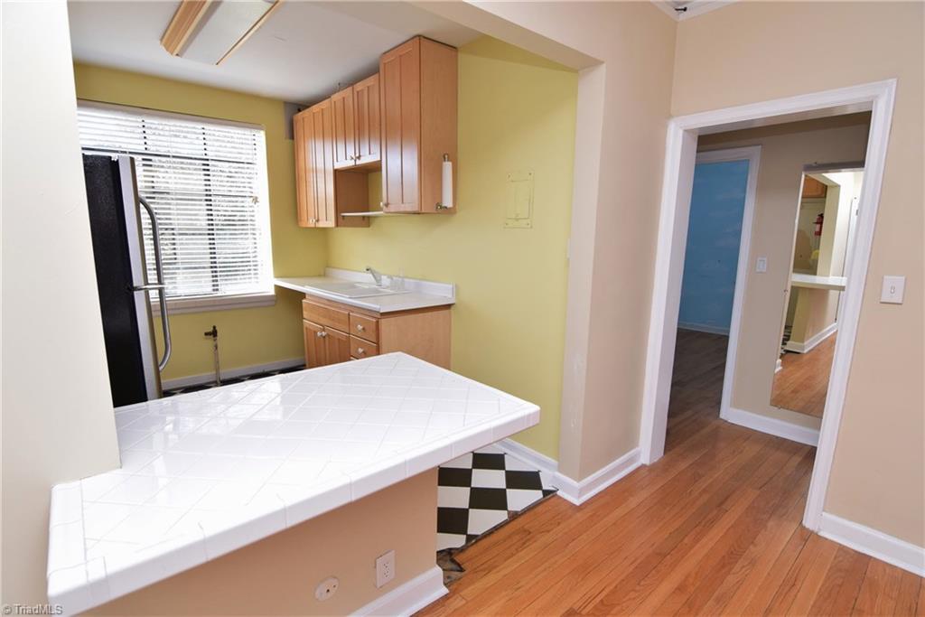 1217 North Main Street, Unit D High Point, NC 27262 - Photo 9 of 30 Kitchen has a breakfast bar area.