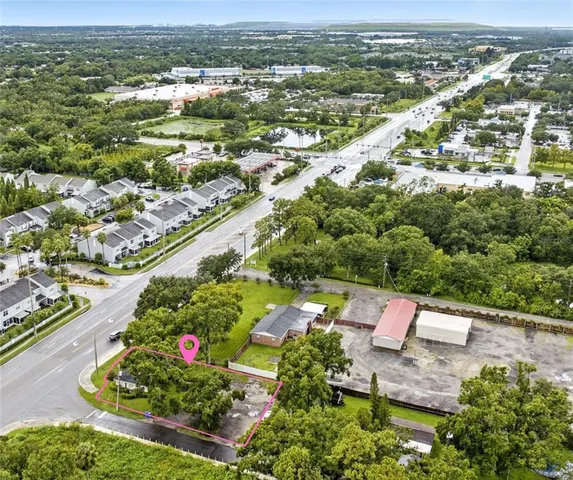 an aerial view of residential houses with outdoor space