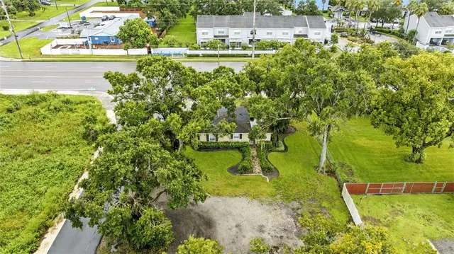 a view of a yard with swimming pool