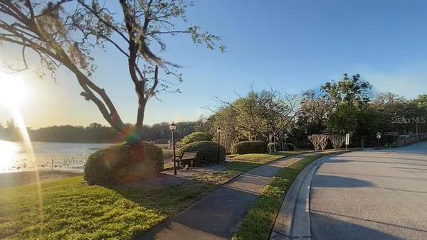 a view of a lake with houses in the back