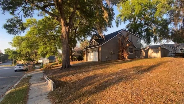 a view of road with card and trees