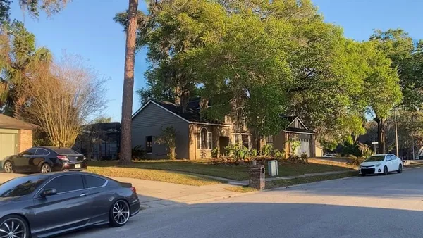 a view of a street with houses on the side